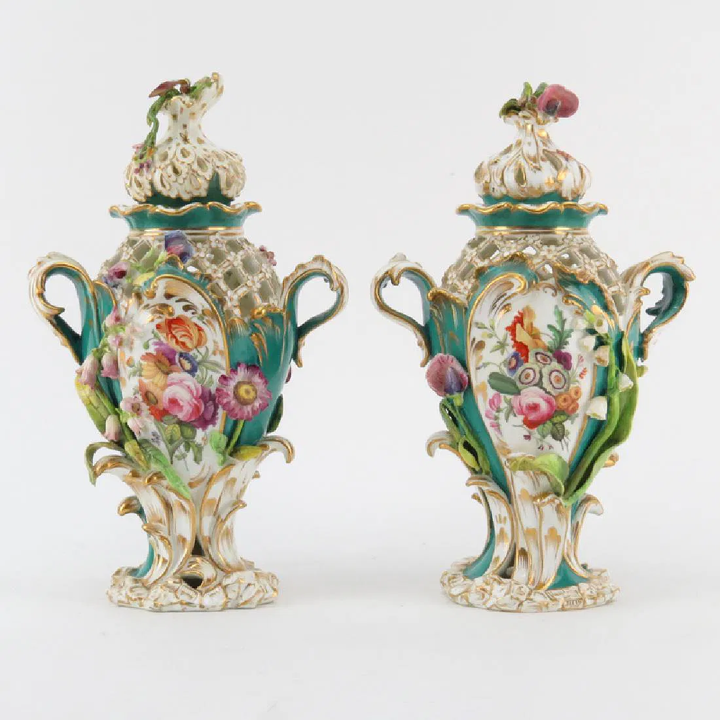 Pair of English Rococo Revival porcelain urns illustrating the over-abundance of ornament and what was considered bad design by Design Reformers
