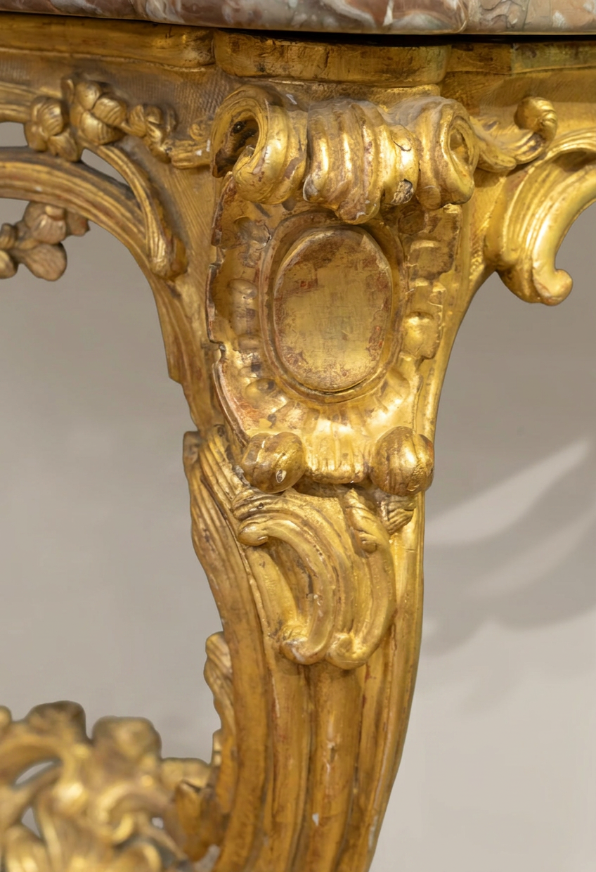 Detail of a rocaille cartouche on a Louis XV carved and gilded console table