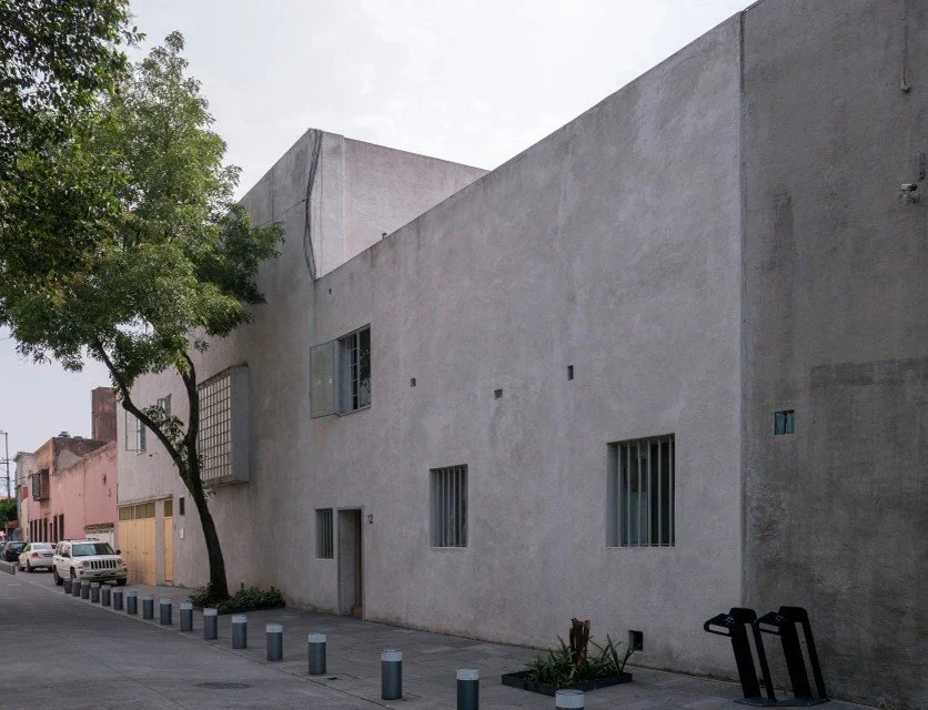 Exterior of Luis Barragán's House and Studio in Mexico City, where a restrained Modernist aesthetic reveals the foundation of his later, more expressive architectural language.