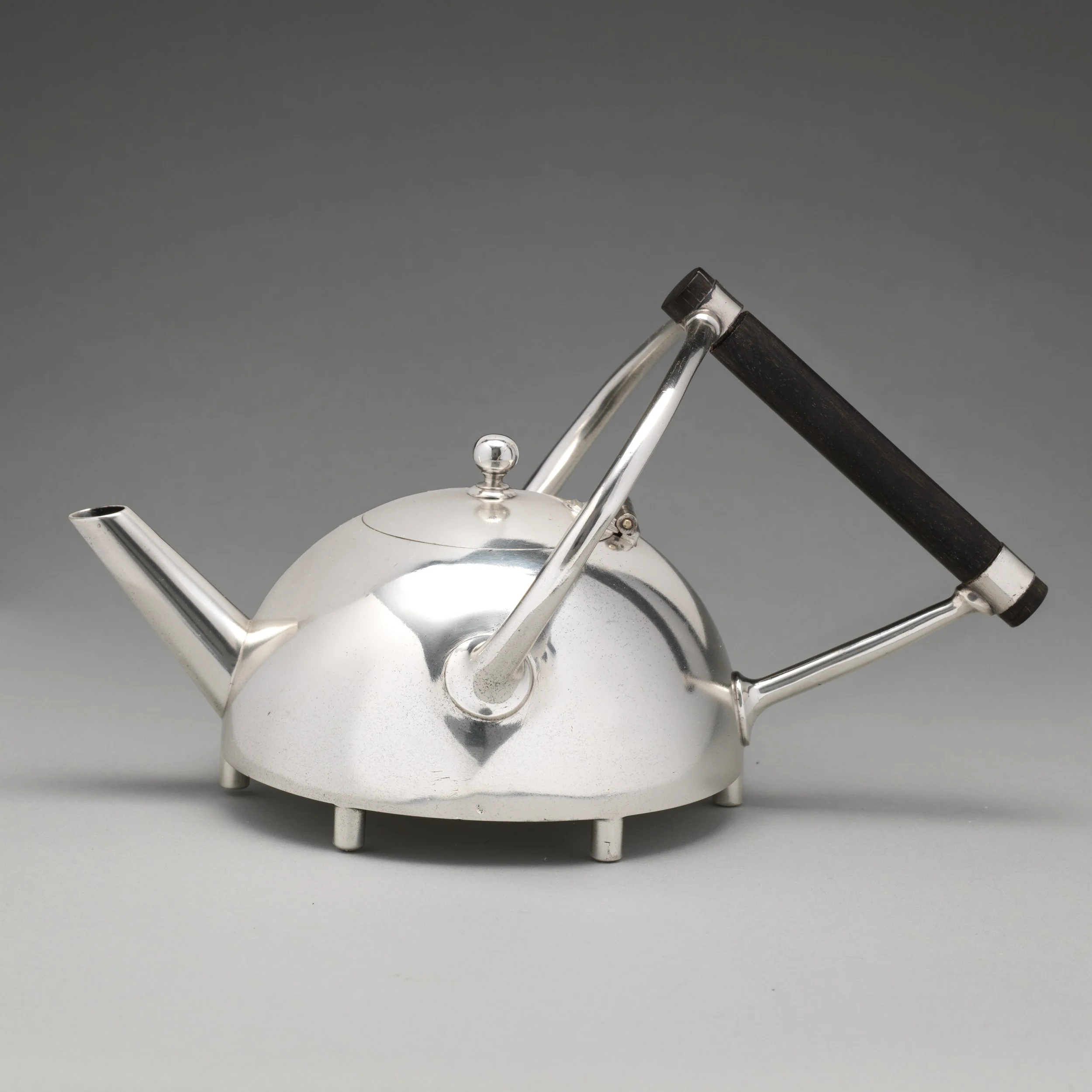 Minimal, silver-plated tea pot with ebony handle, illustrating the "new" aesthetic preferred by many Reformers, which drew upon non-Western, non-Classical sources of influence