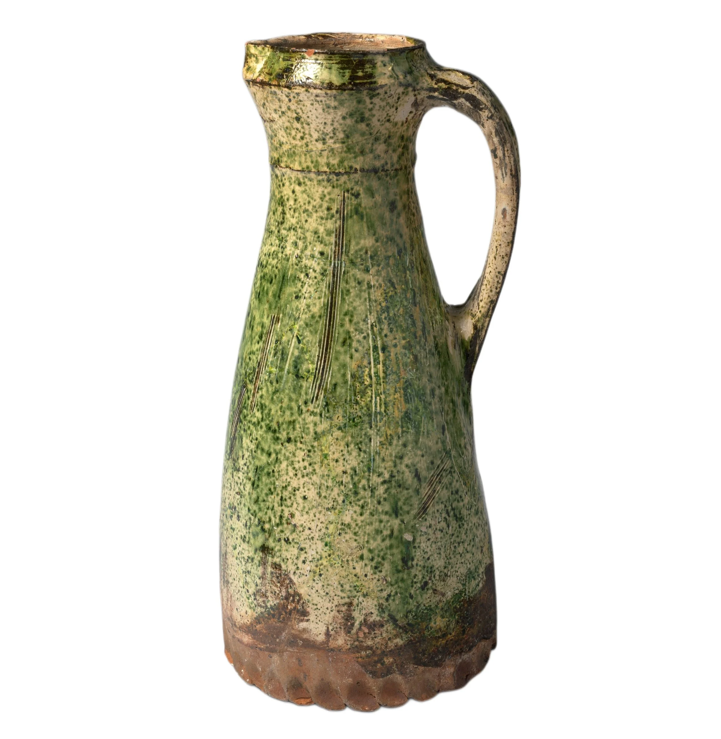 14th-century English green-glazed jug showing hand-thrown irregularity.