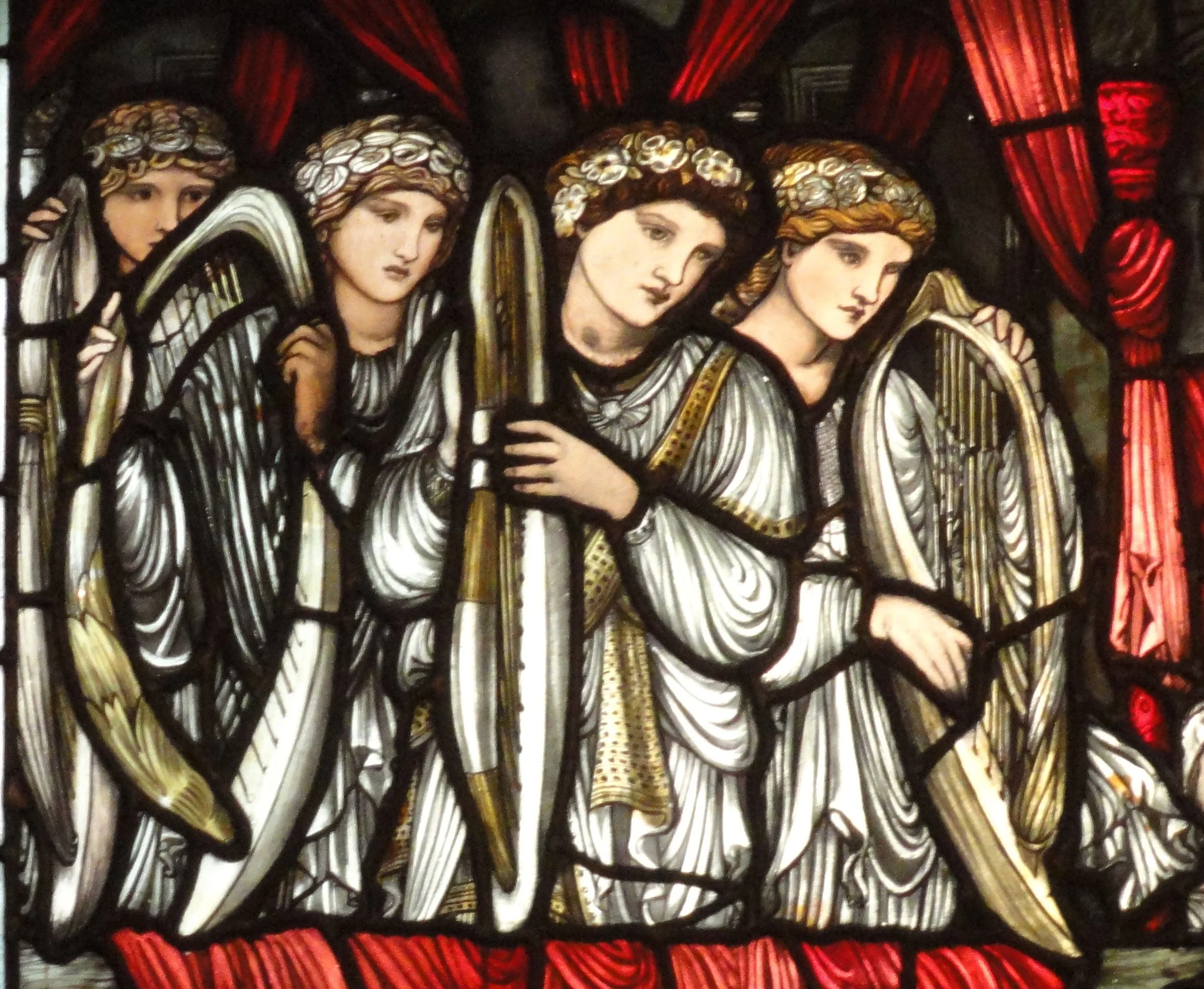 Detail from The Charge of David to Solomon stained glass window by Morris & Co. and Burne-Jones depicting a group of four angels with harps