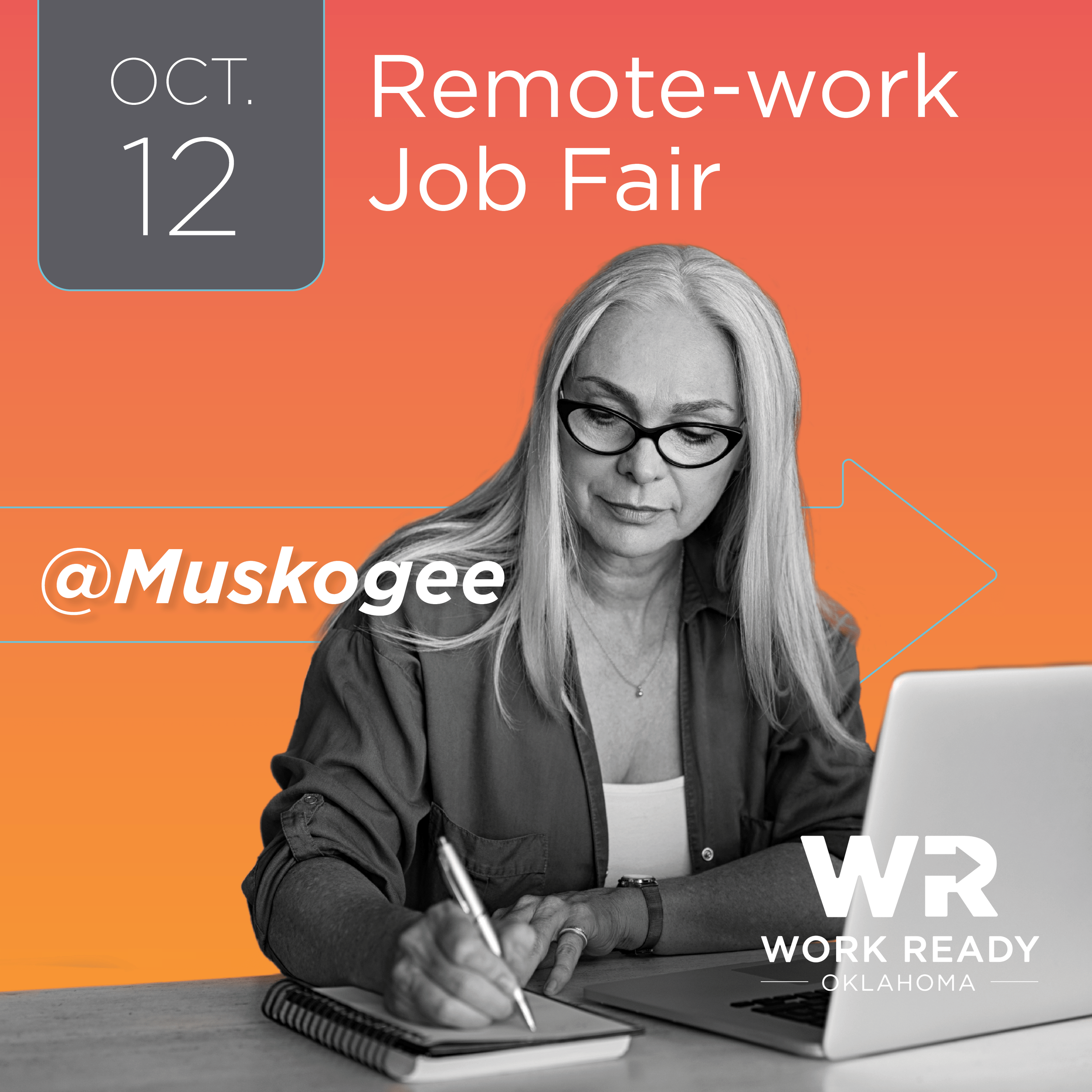 A woman in glasses working at computer