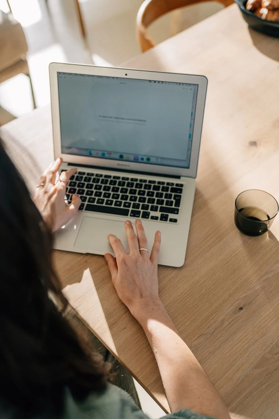 Small business owner easily writing the words on her website so it converts.