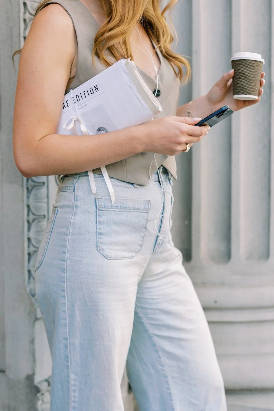 Small business owner on phone and laptop optimizing local SEO visibility