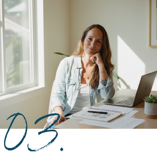 Close-up of a person turning pages of a photo album on a sofa.