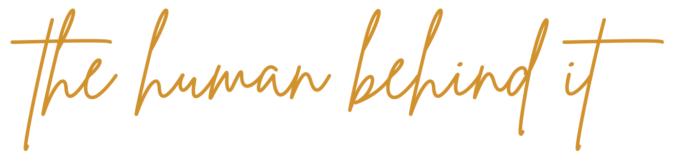Text that reads 'the human behind it' in cursive, gold-colored font