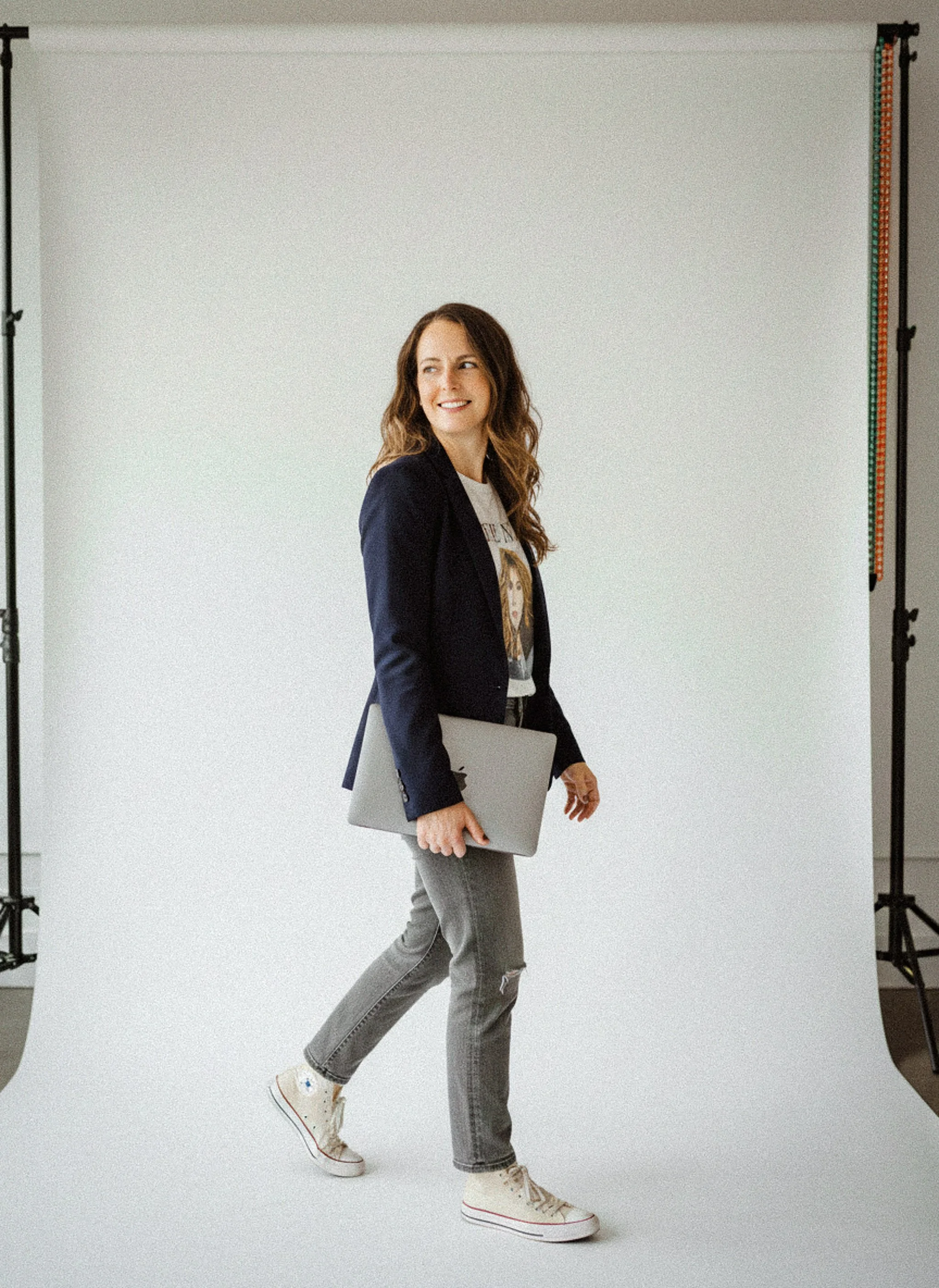 SEO strategist walking confidently with laptop, representing clear and guided search strategy