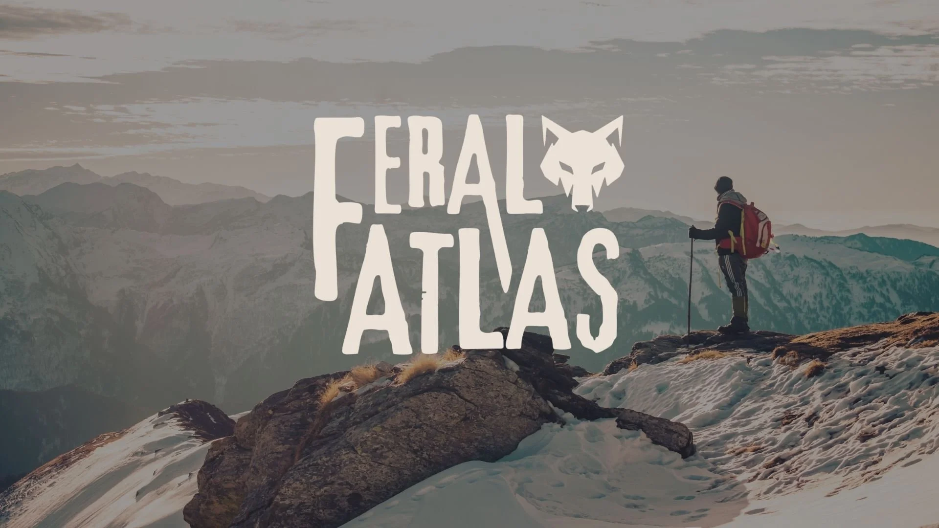 Rugged, masculine, Outdoor lifestyle brand logo displayed over a mountain hiking scene.