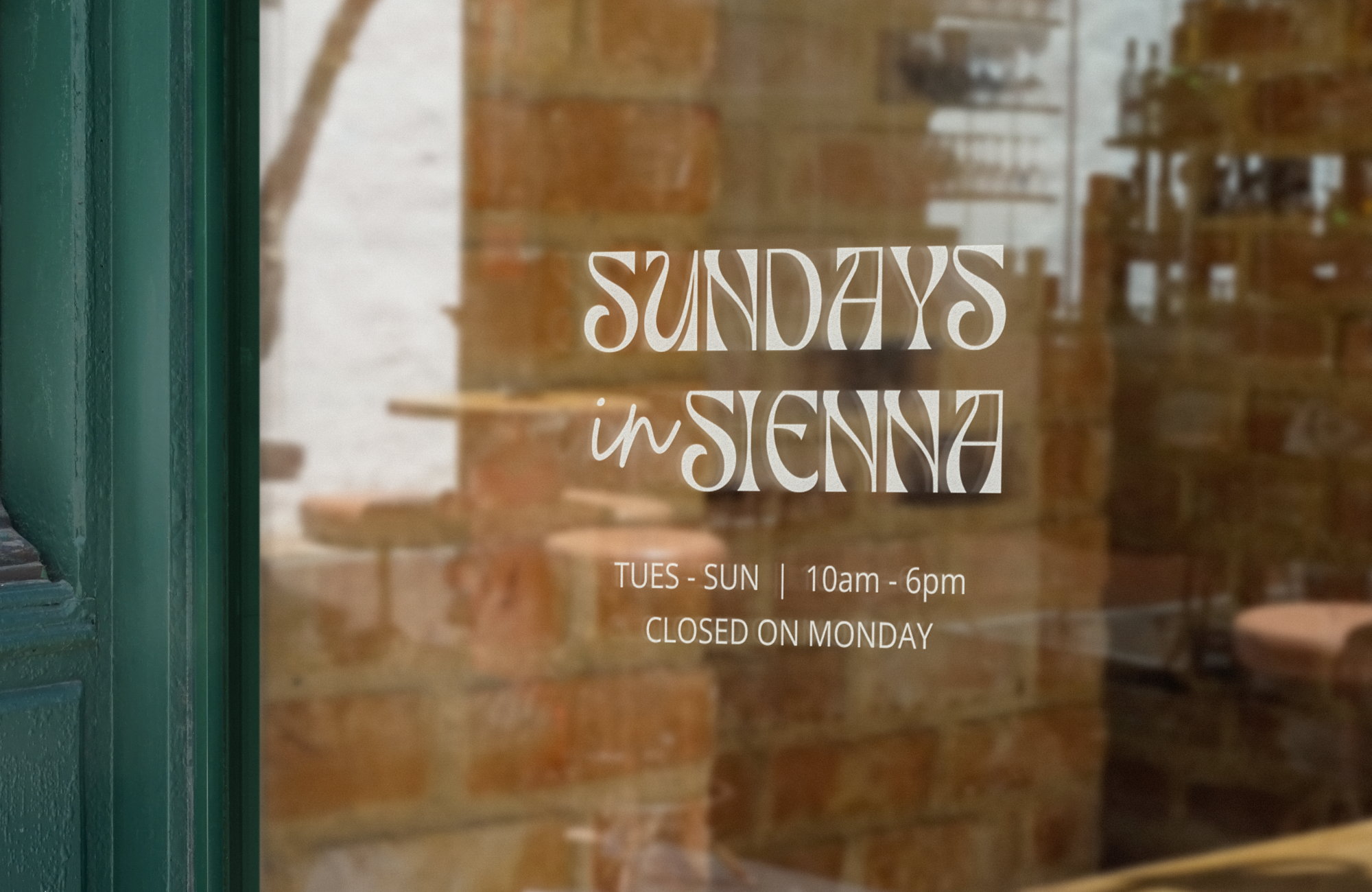 Window signage design for a small lifestyle shop with hand-drawn typography.