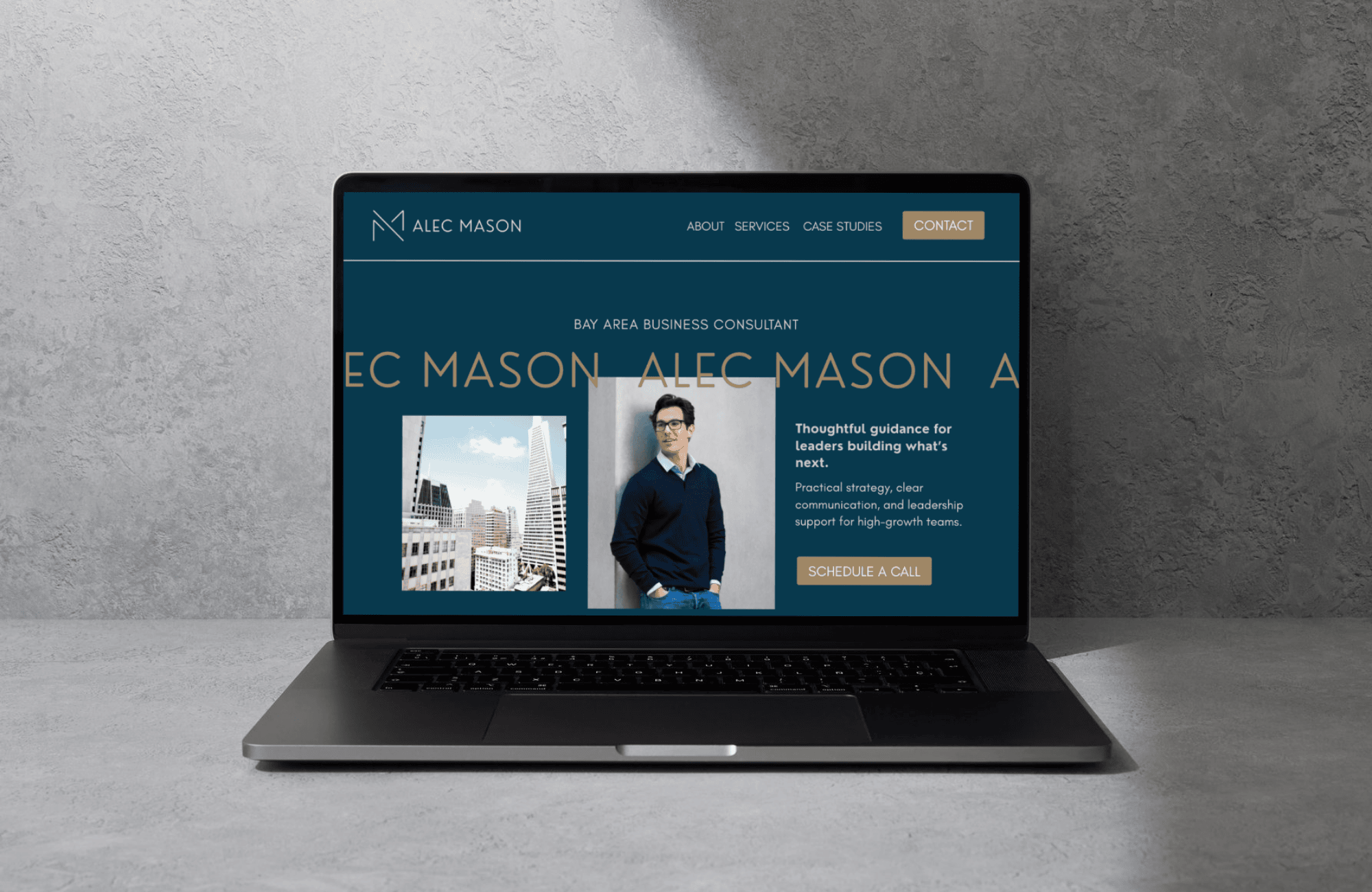 Laptop displaying a professional website for Alec Mason, a Bay Area business consultant, with a photo of a city skyline and a man in a blue sweater.