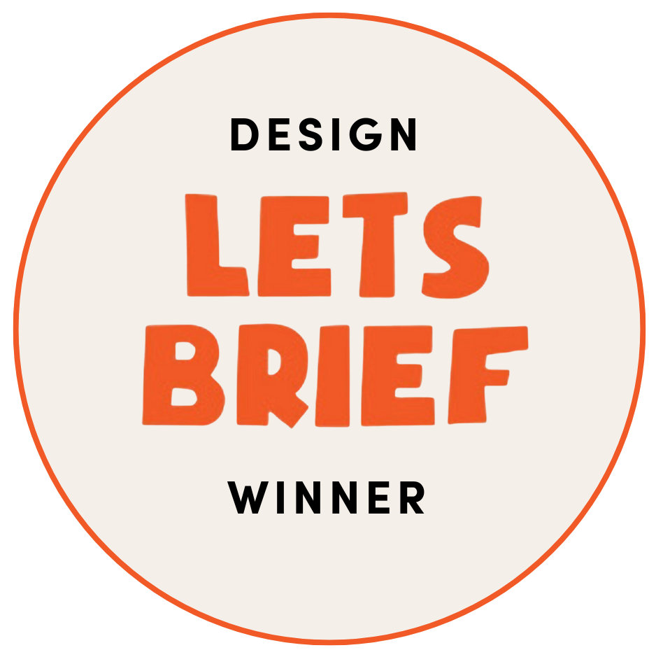 Circular badge with text stating 'Design Lets Brief Winner', with 'Lets Brief' in large orange letters and the other words in black, on a white background with a red border.
