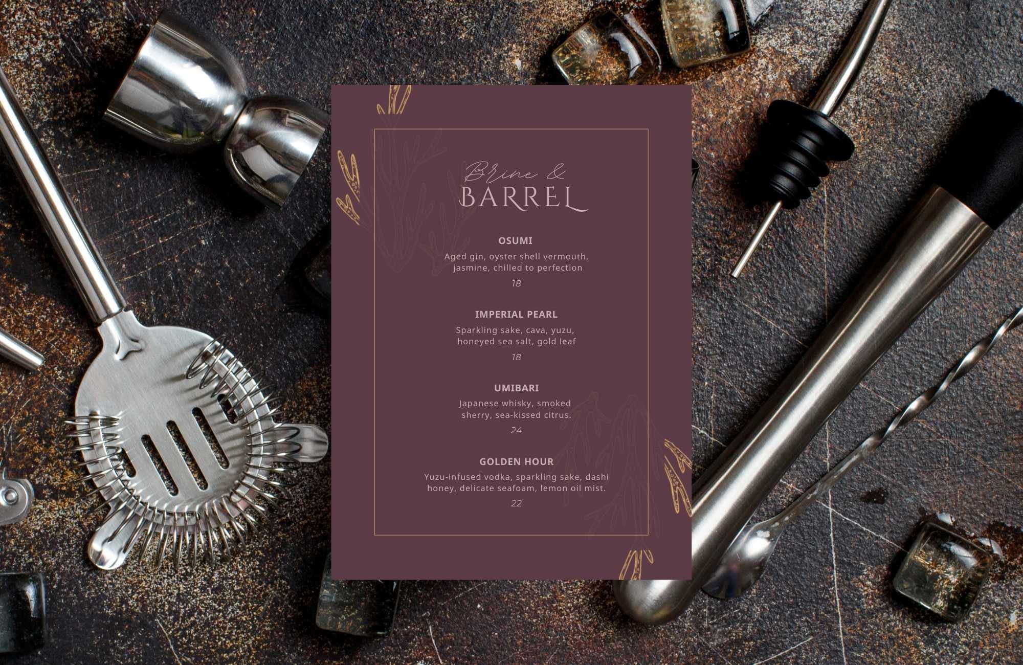 Close-up of premium seafood restaurant bar menu surrounded by cocktail tools, showcasing elegant design with custom illustrations and gold typography.