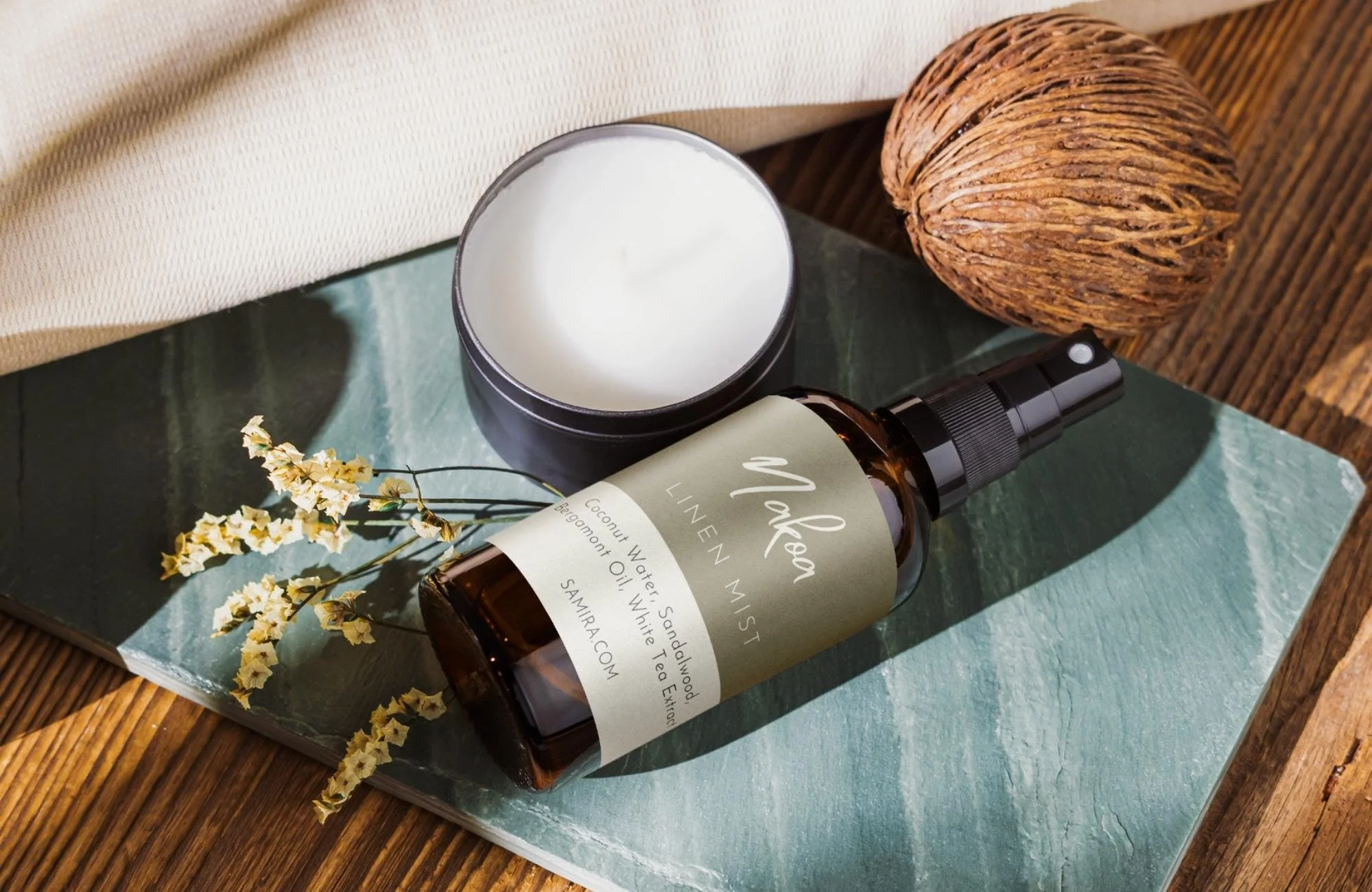 Custom-branded wellness products for luxury yoga retreat, including signature linen mist, candle, and botanical-inspired packaging design.