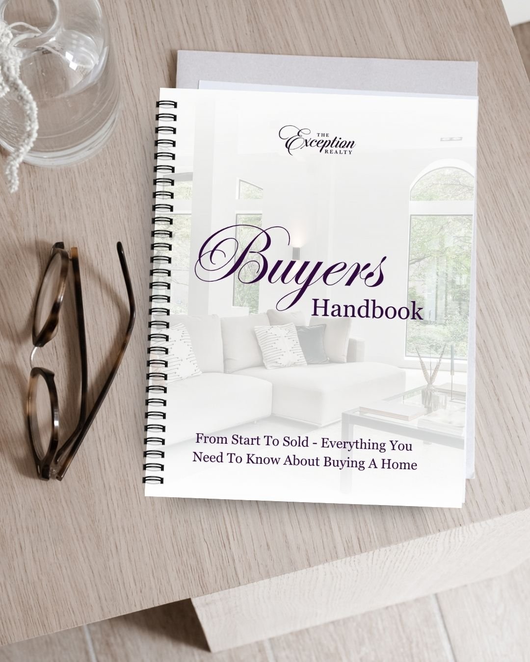 flatlay showing the design of an ebook cover home buyer guide marketing collateral for real estate