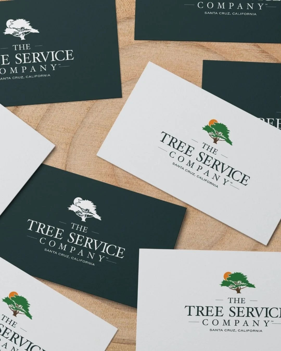 Business card designs for The Tree Service Company featuring a sophisticated, clean aesthetic with branding elements for a professional impression.
