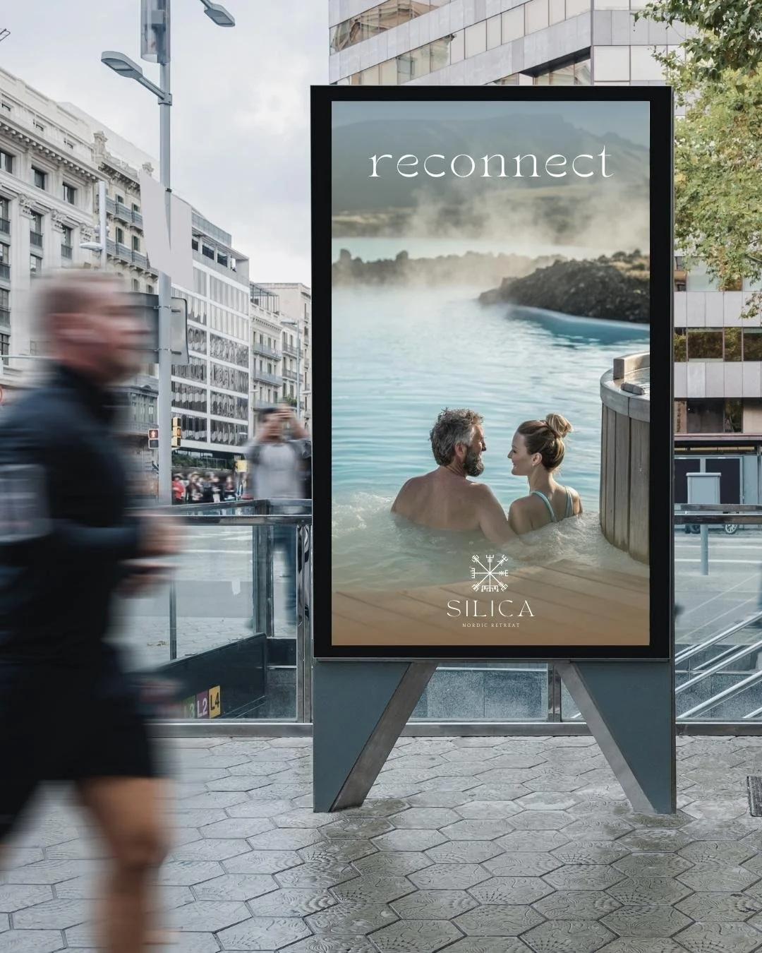 Outdoor billboard for Silica Spa showcasing a couple relaxing in a geothermal pool with the tagline "Reconnect."