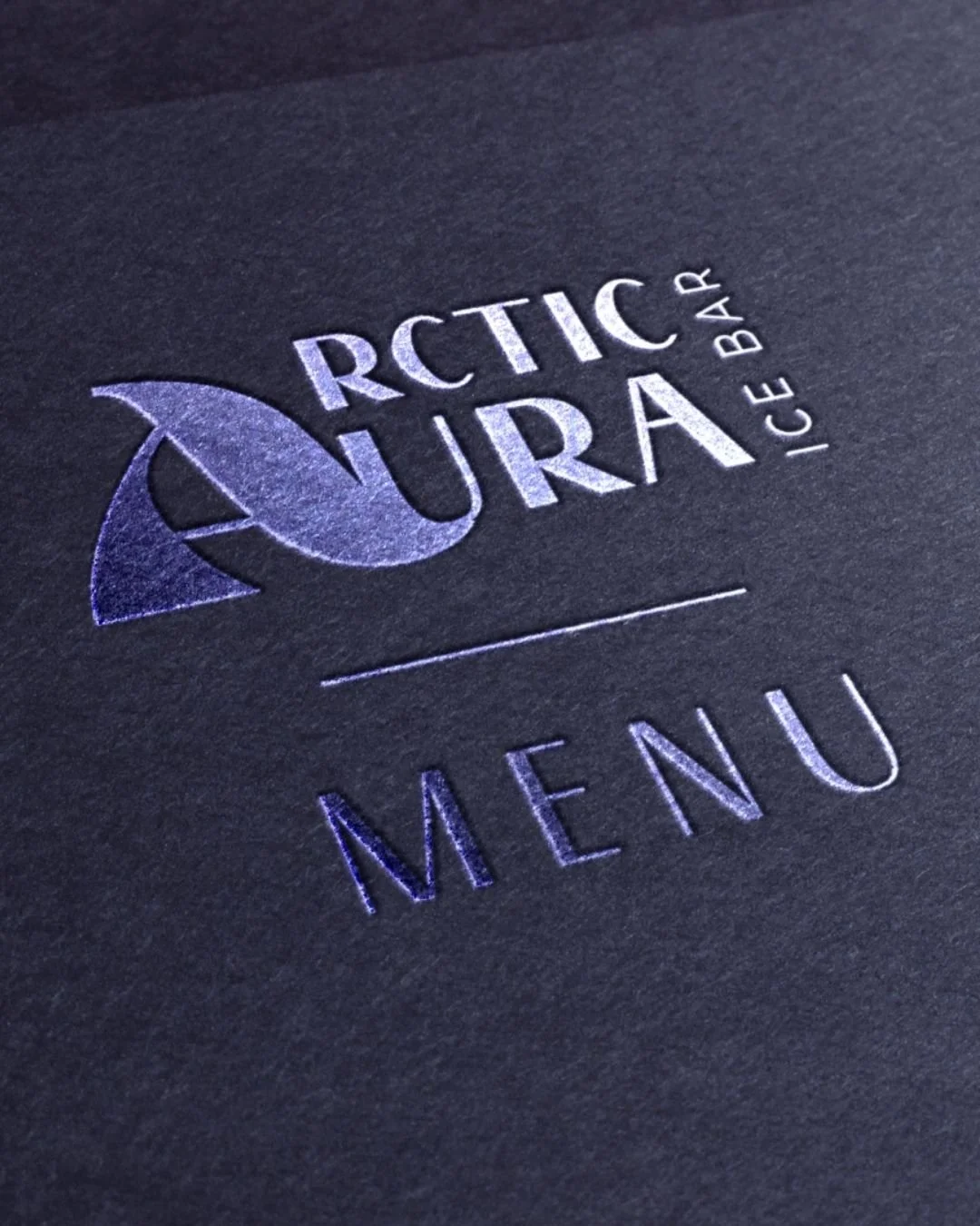 close up of an ice bar logo embossed on a menu