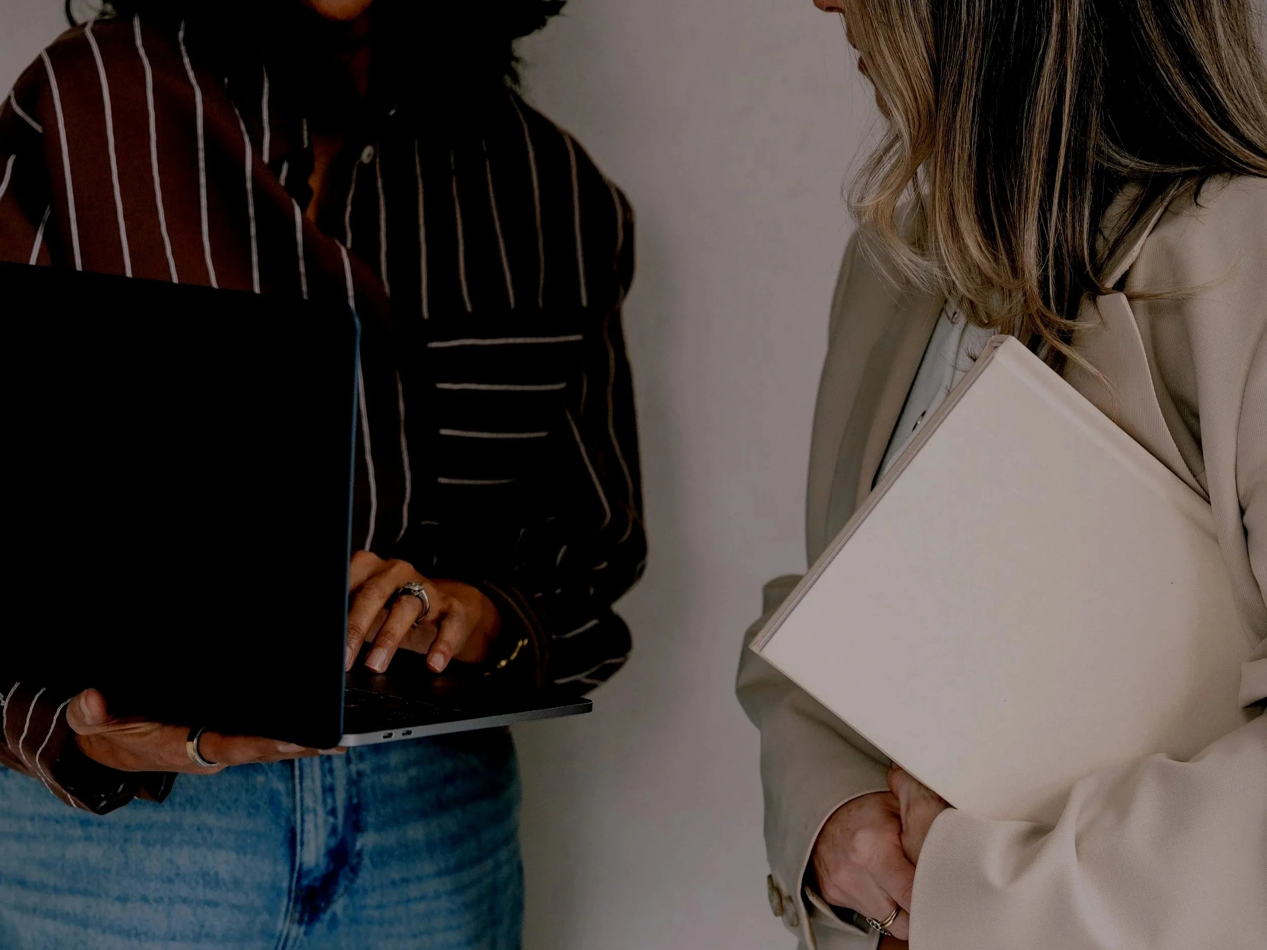 Small business owners reviewing brand strategy before hiring a brand designer