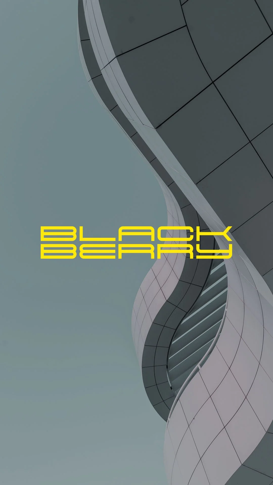 Modern architectural building with curved metallic and glass surfaces, with yellow text reading 'BLACK BERRY'.