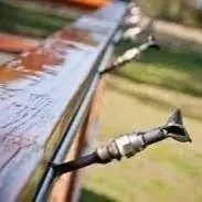 Platypus Wildfire Sprinkler System roofline sprinkler heads mounted on a home