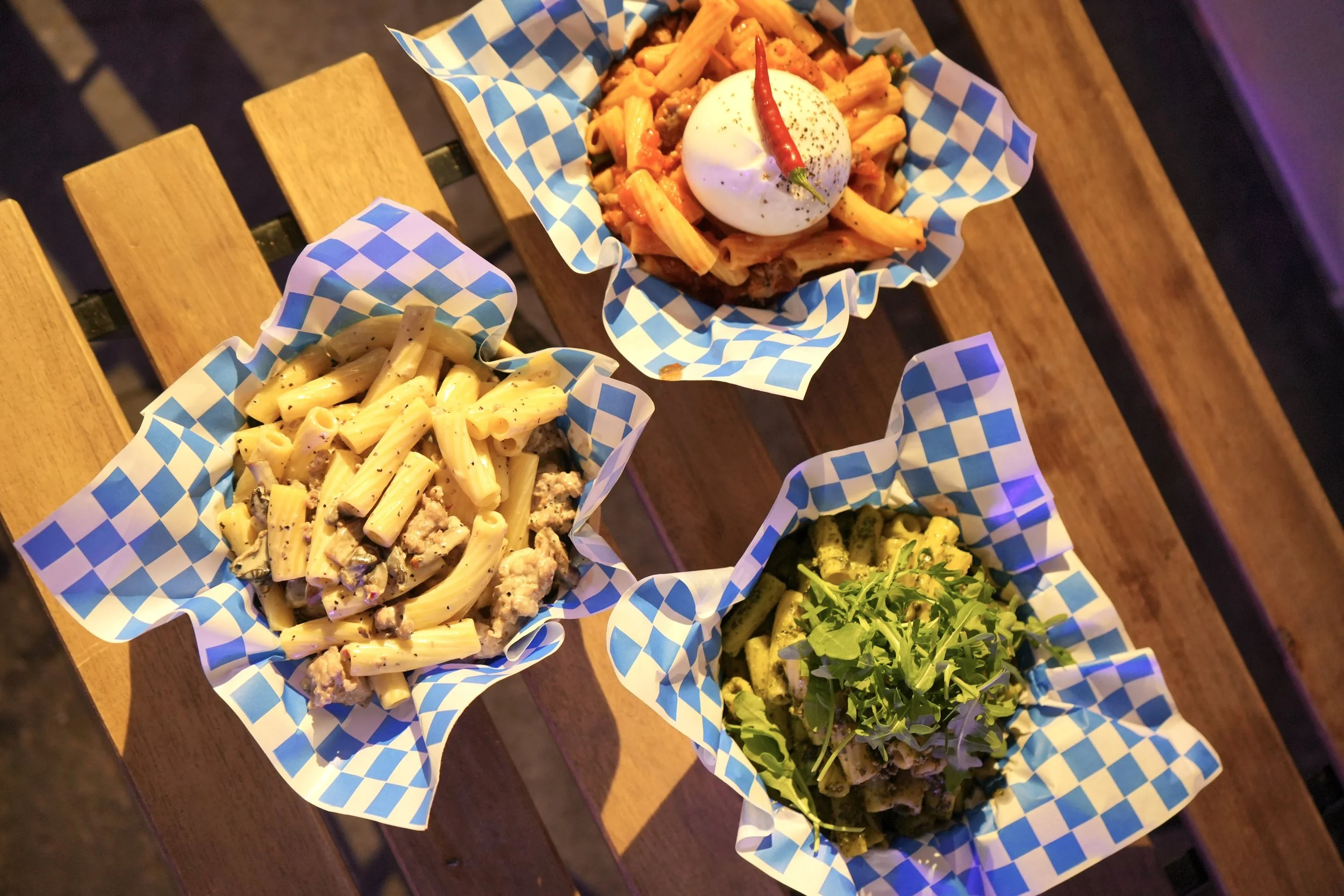 3 pastas with a slection of colours and toppings