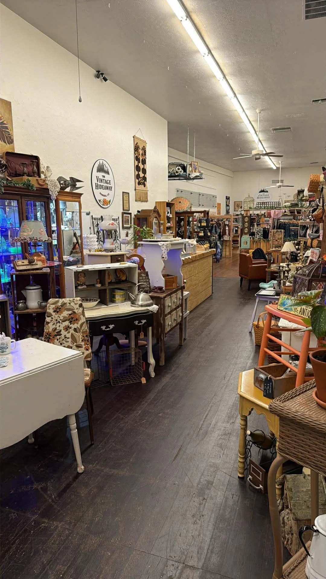 inside view of shop window at the Vintage Hideaway showing antiques, and vintage items