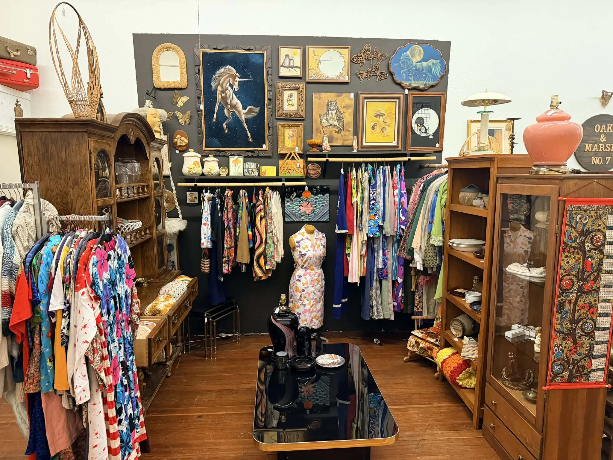 view of one of the vendors inside the shop window at the Vintage Hideaway showing antiques, and vintage items