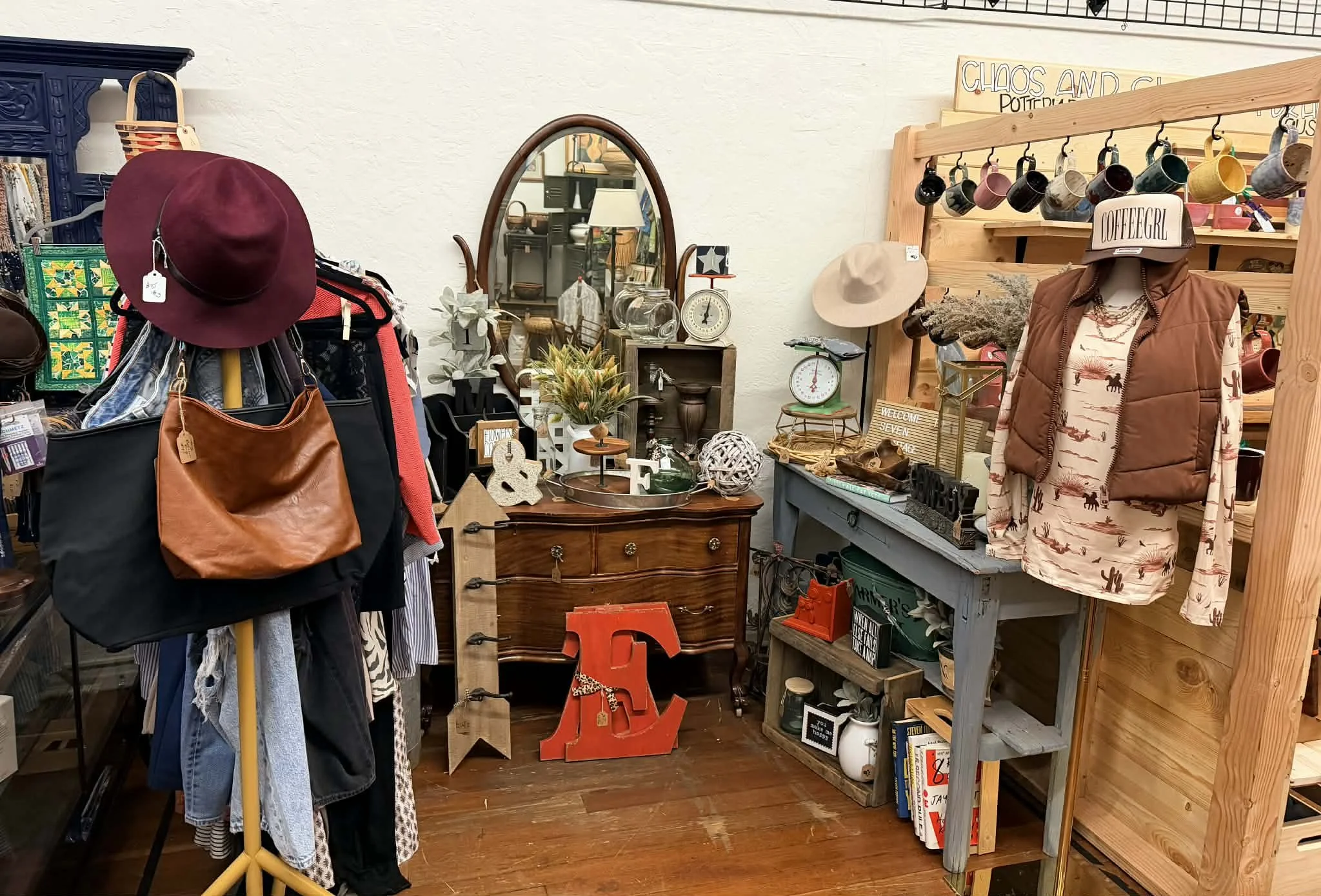view of one of the vendors inside the shop window at the Vintage Hideaway showing antiques, and vintage items