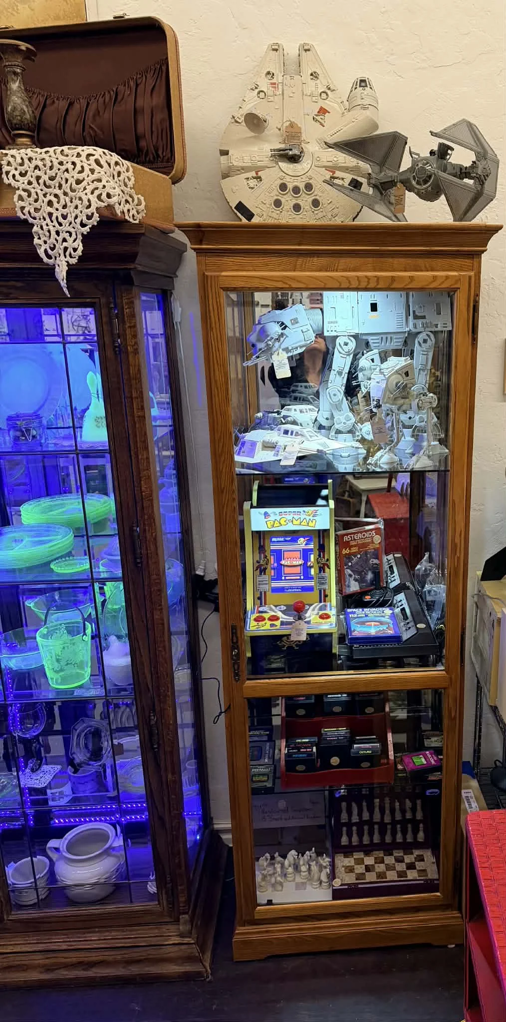 view of one of the vendors inside the shop window at the Vintage Hideaway showing antiques, and vintage items