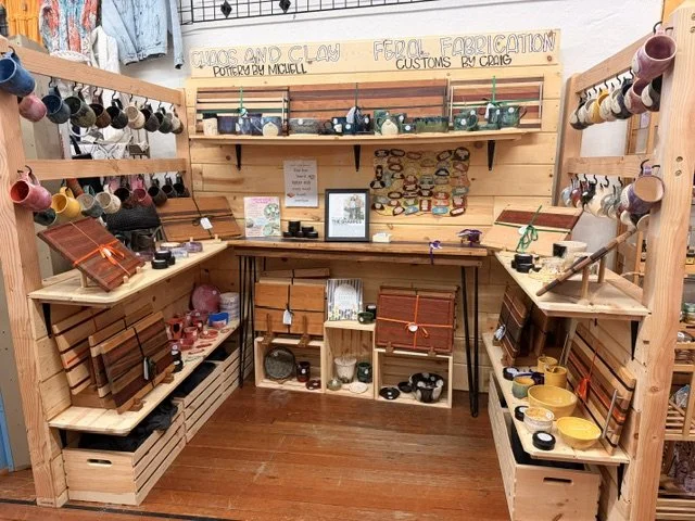 view of one of the vendors inside the shop window at the Vintage Hideaway showing antiques, and vintage items