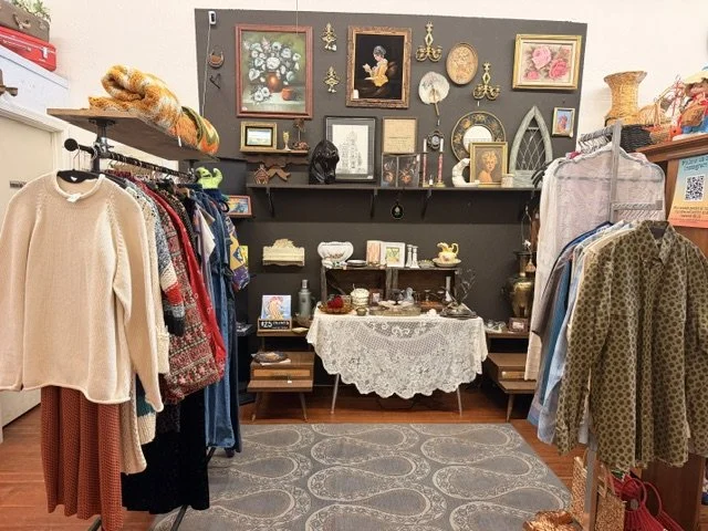 view of one of the vendors inside the shop window at the Vintage Hideaway showing antiques, and vintage items