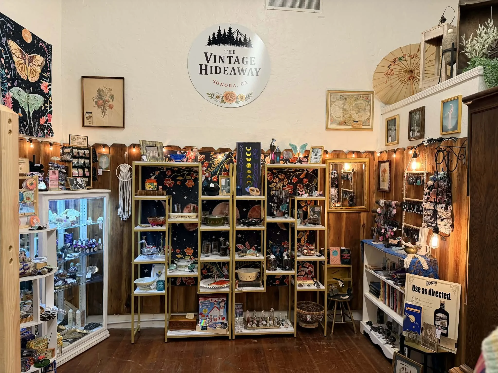view of one of the vendors inside the shop window at the Vintage Hideaway showing antiques, and vintage items