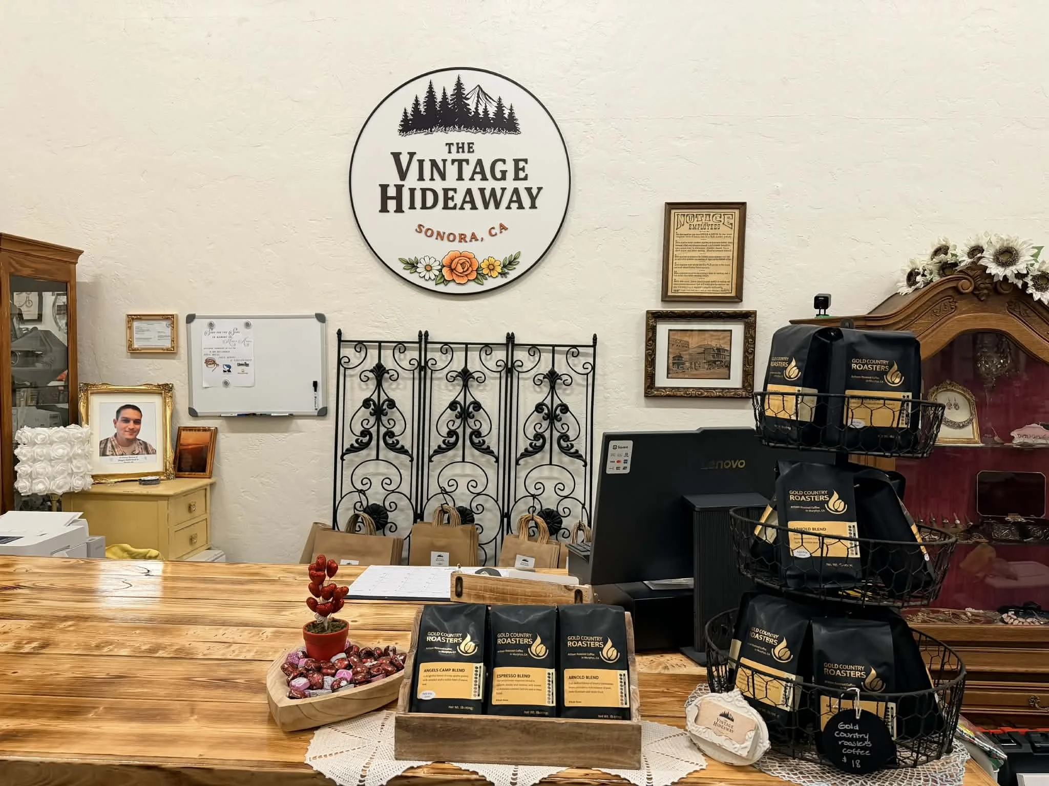 view of one of the vendors inside the shop window at the Vintage Hideaway showing antiques, and vintage items
