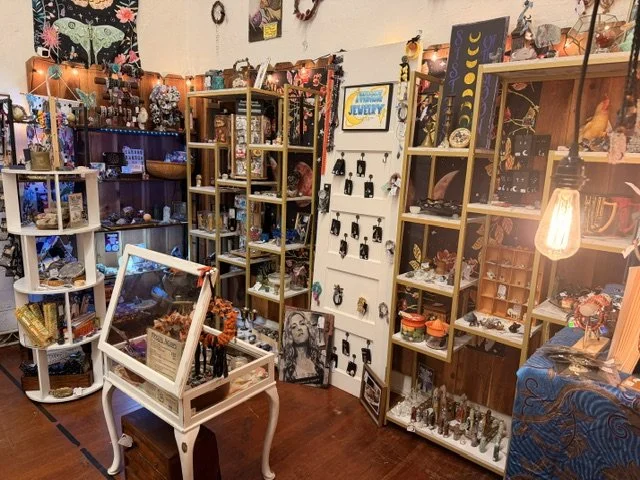 view of one of the vendors inside the shop window at the Vintage Hideaway showing antiques, and vintage items