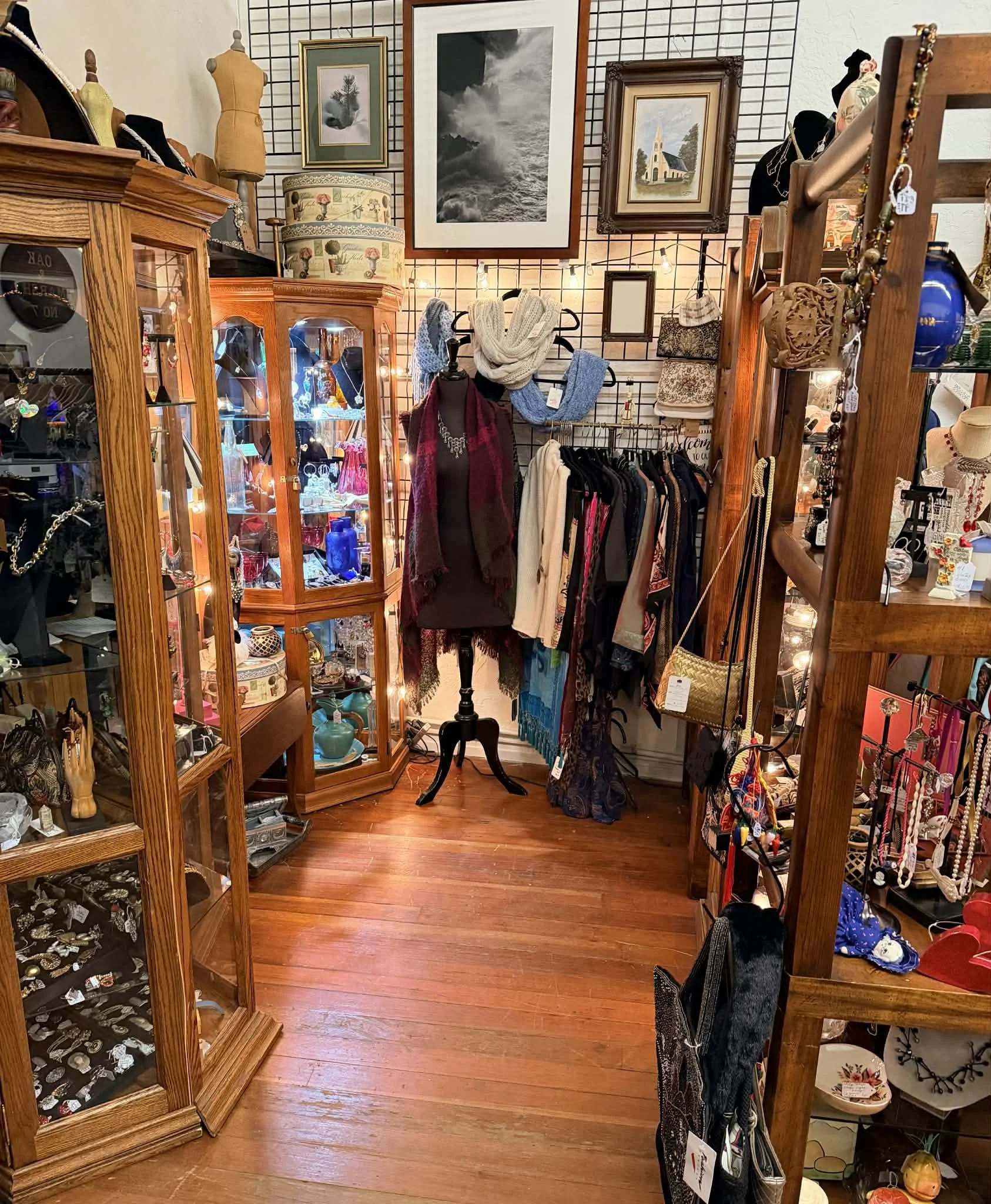 view of one of the vendors inside the shop window at the Vintage Hideaway showing antiques, and vintage items