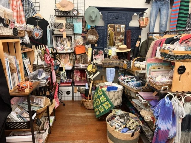 view of one of the vendors inside the shop window at the Vintage Hideaway showing antiques, and vintage items