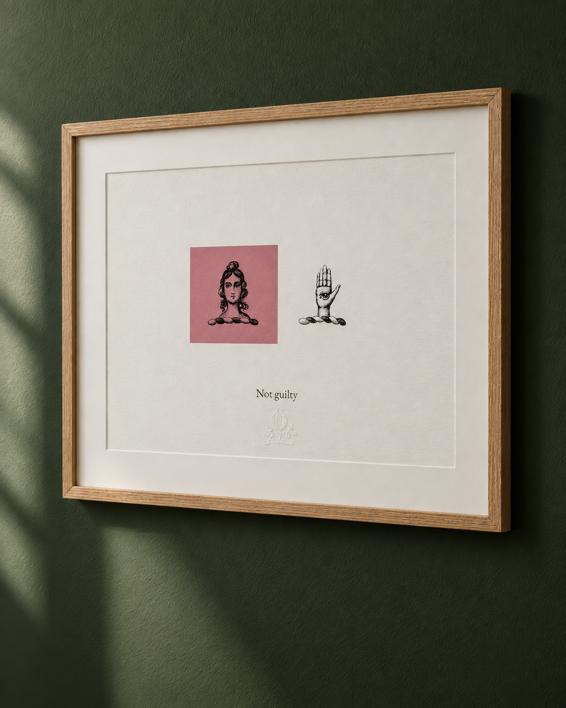Framed artwork with two illustrations: a woman with an elaborate hairstyle and beads on her neck, and a hand with an eye in the palm, surrounded by stones. The text underneath reads "Not guilty."