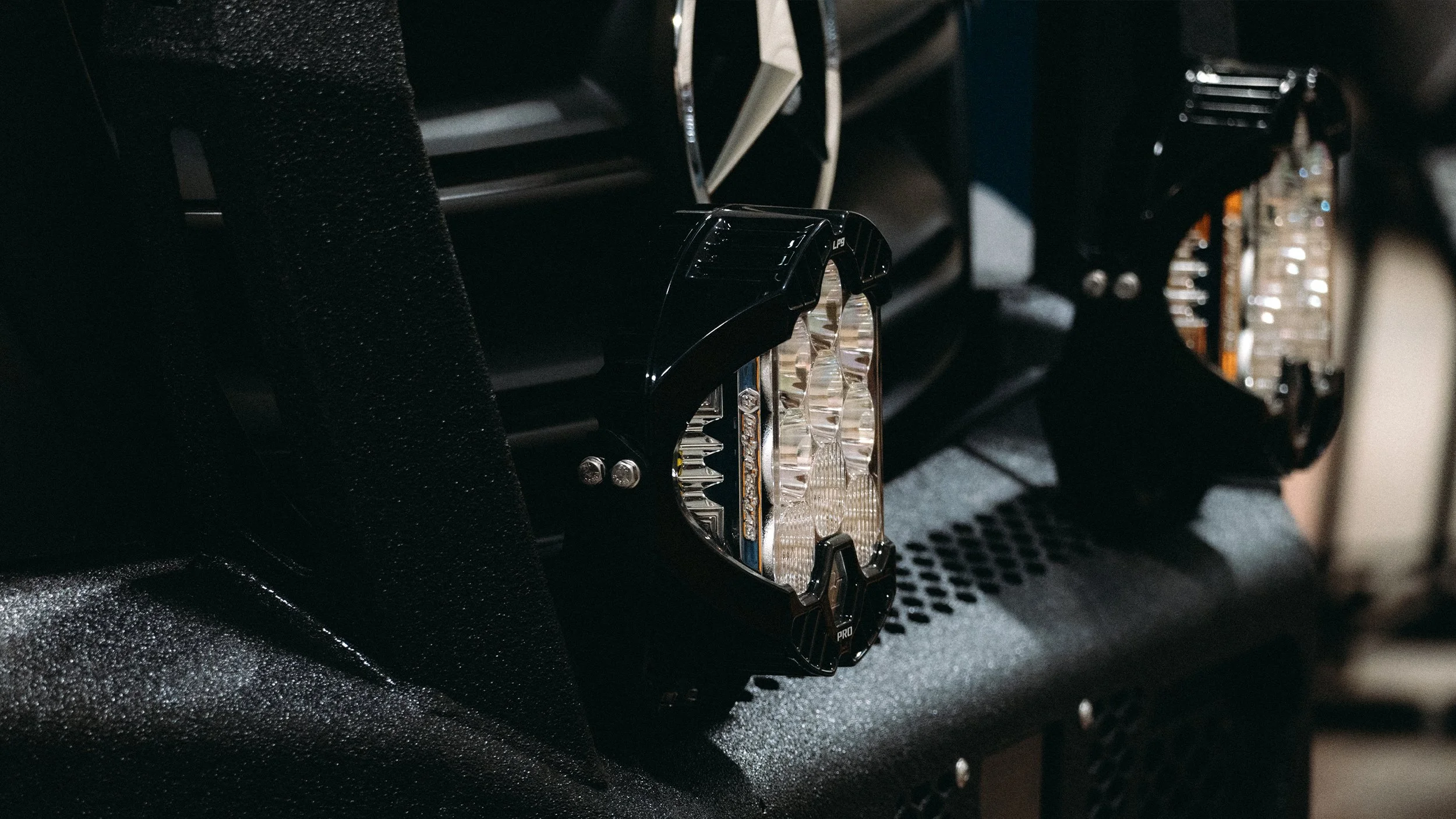 Close-up of LED light bars installed on a vehicle's dashboard.