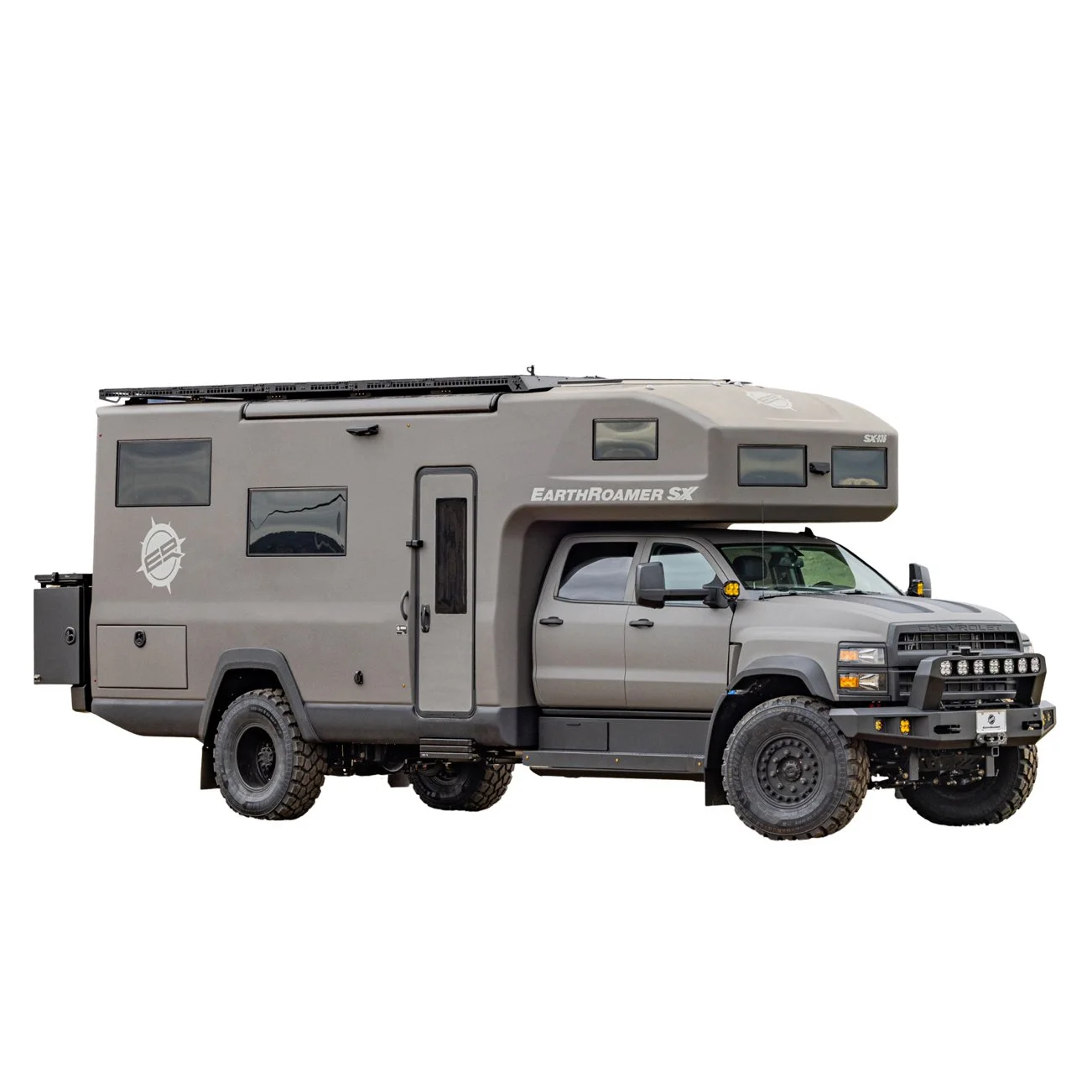 A gray earth-roamer camper truck with multiple windows, off-road tires, and a raised roof for additional sleeping or living space.