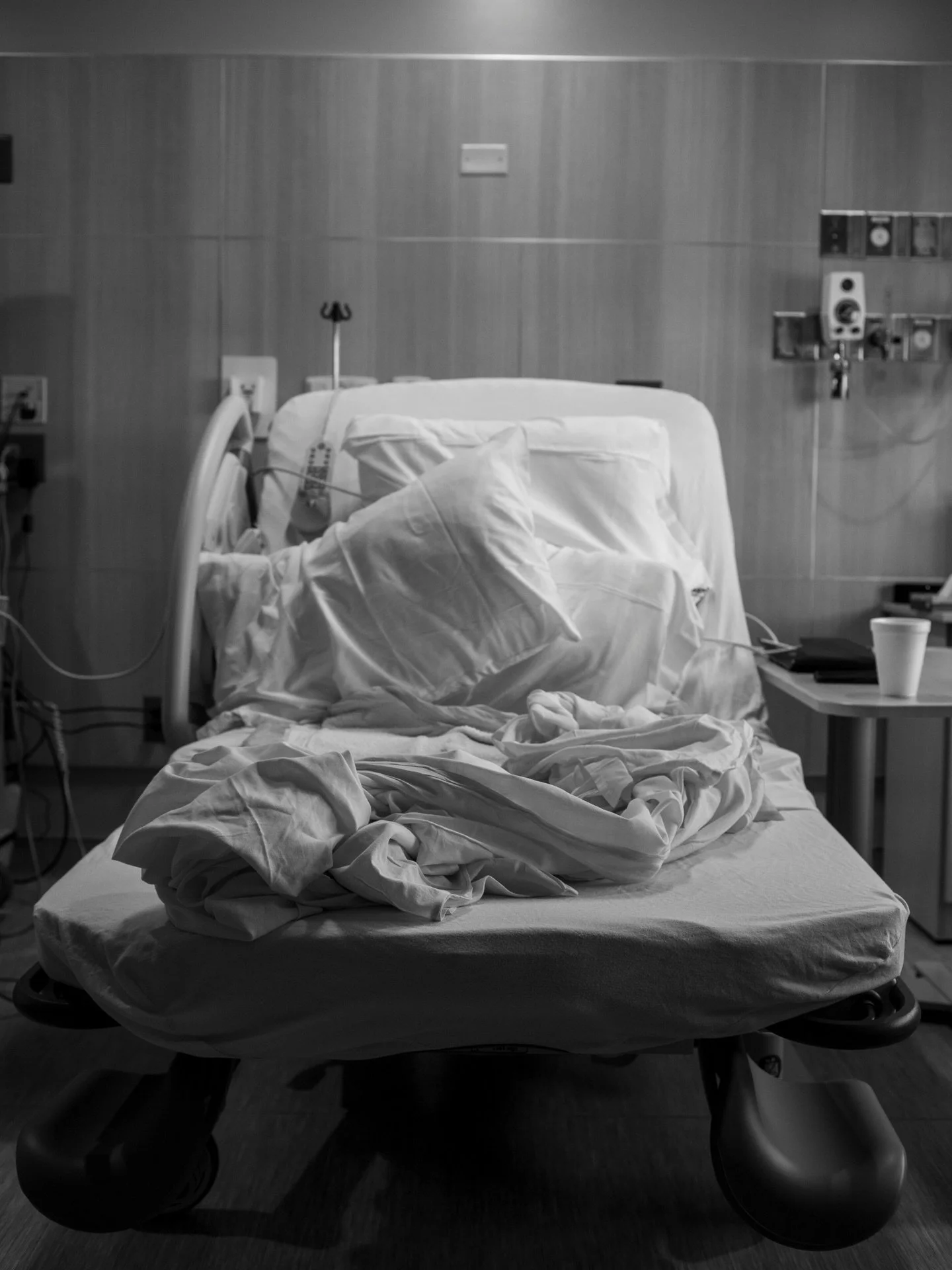 The hospital bed was empty. 

She laid on the ground for what felt like hours. She was meditative. Working through laborland. We moved pillows and blankets down to provide softness, but it was the cold hard ground she was after. 

We sat close. Her p