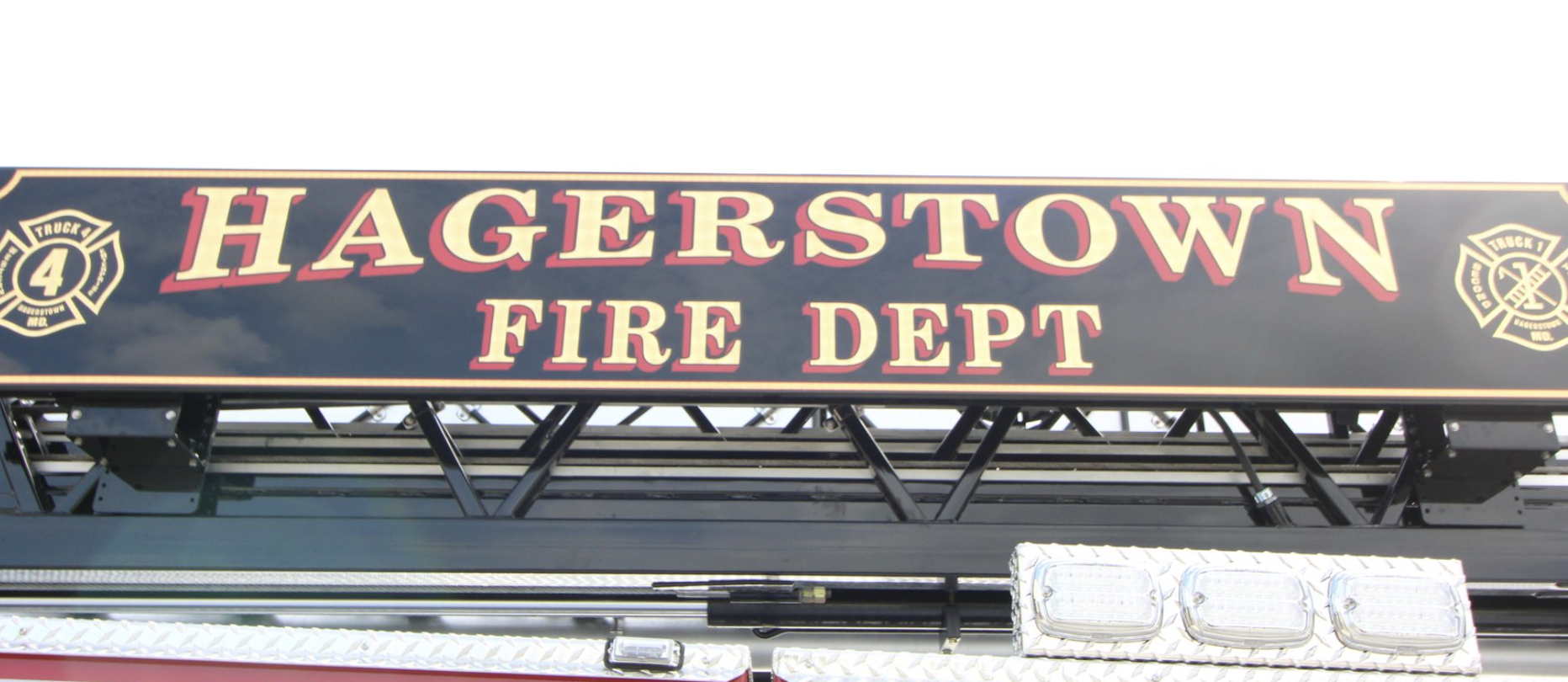 The ladder on top of a firetruck in the not-extended position sitting on top of the truck with the words "Hagerstown Fire Dept."