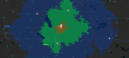 Weather radar map showing a storm over a city, with areas in green and red indicating varying intensities of precipitation.