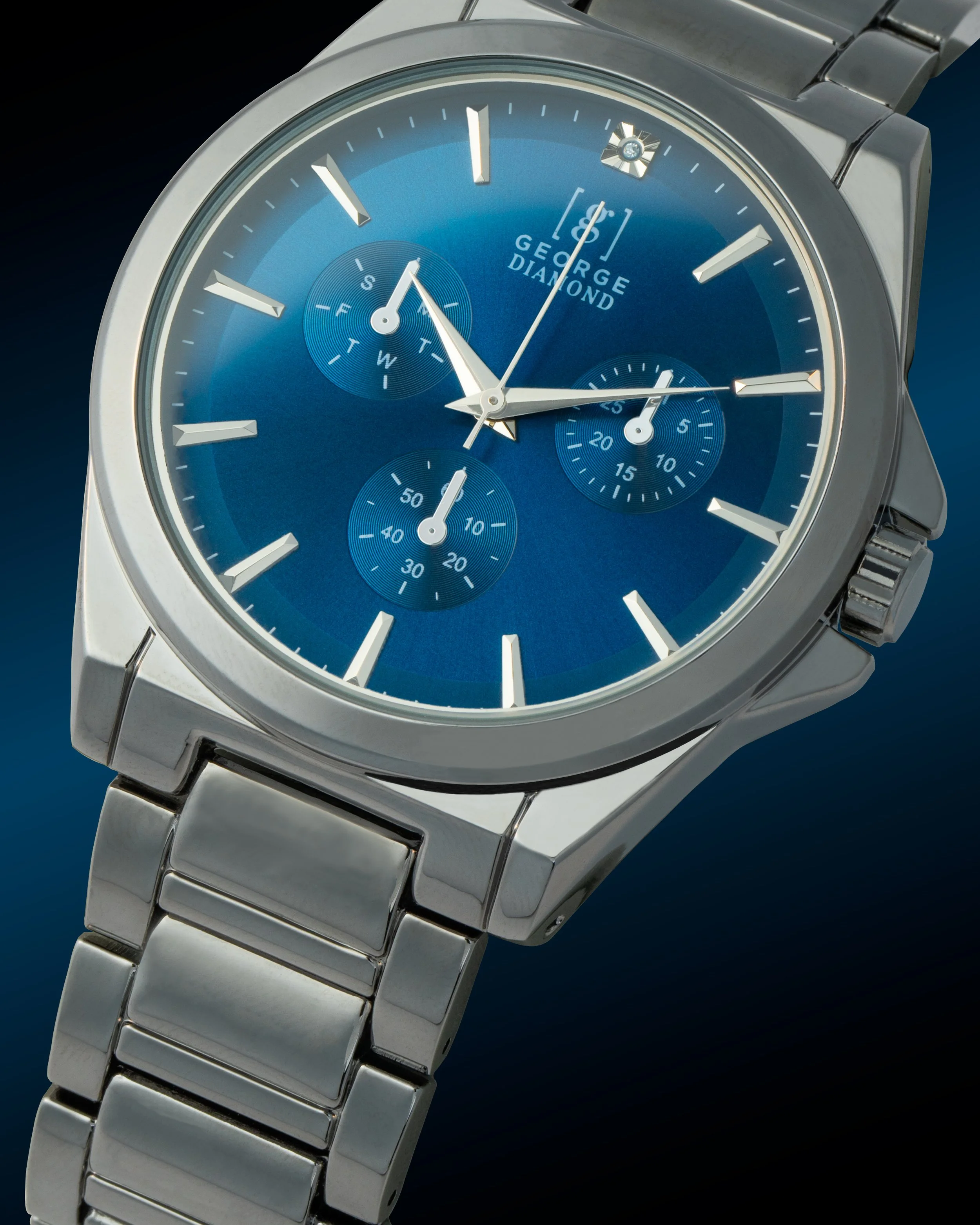 A silver wristwatch with a blue dial, three subdials, and a metal bracelet.