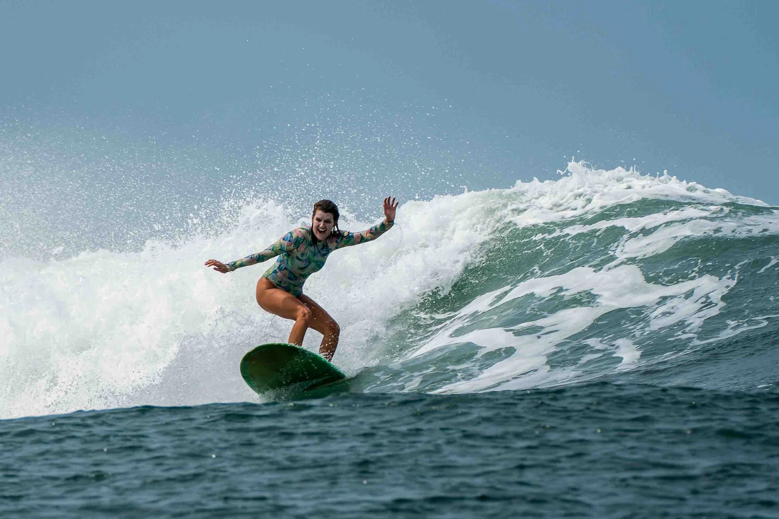 A man with painted face surfing inside a barreling wave.