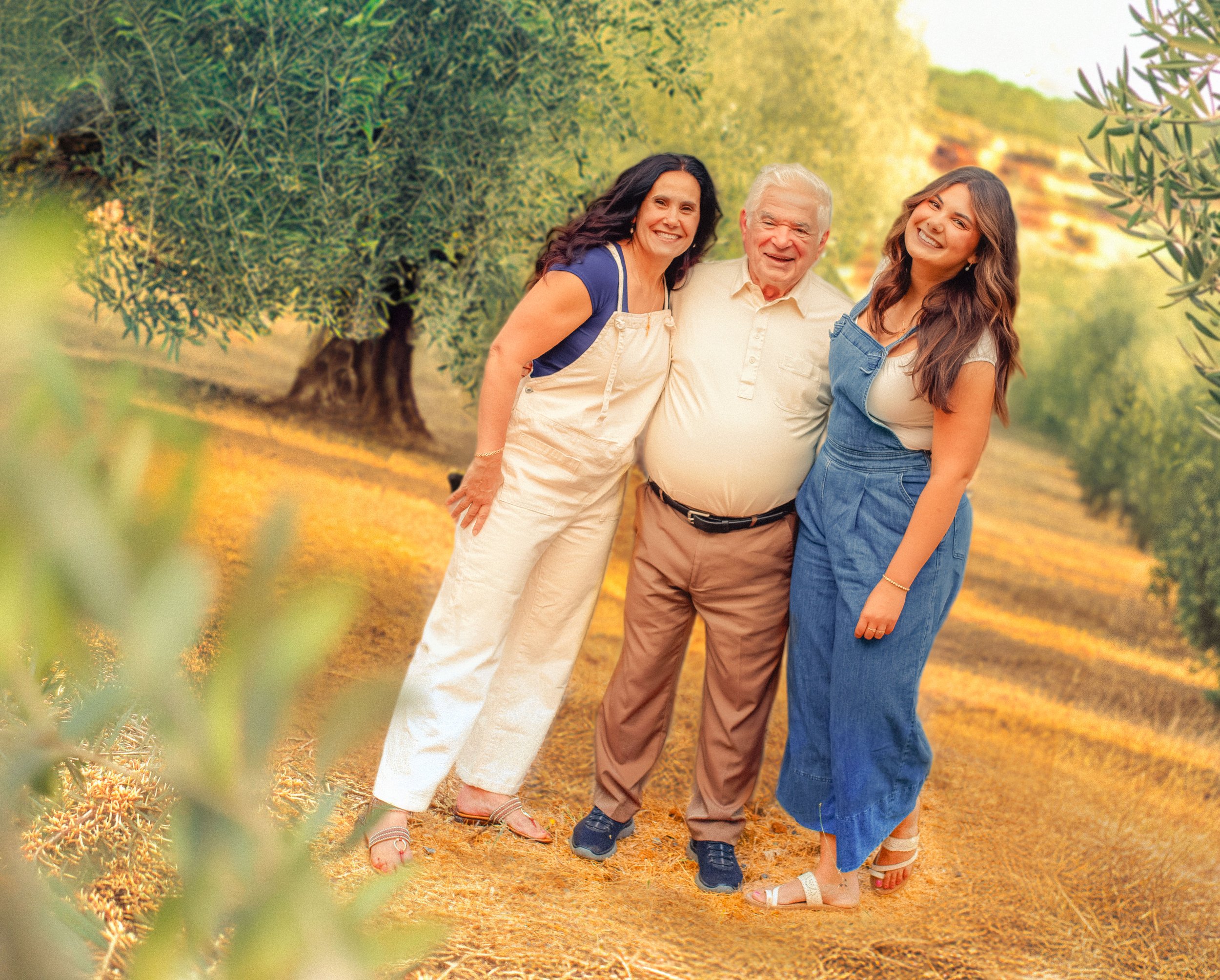 Three generations of Marta’s Greek family gathered together outdoors, reflecting the heritage, family bonds, and connection to the land behind Elia.