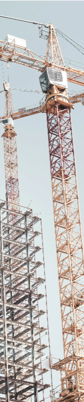 Construction cranes and development project representing commercial construction and infrastructure operations.
