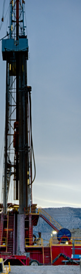 Oilfield drilling rig and support equipment representing well servicing, drilling and oilfield contractor operations.