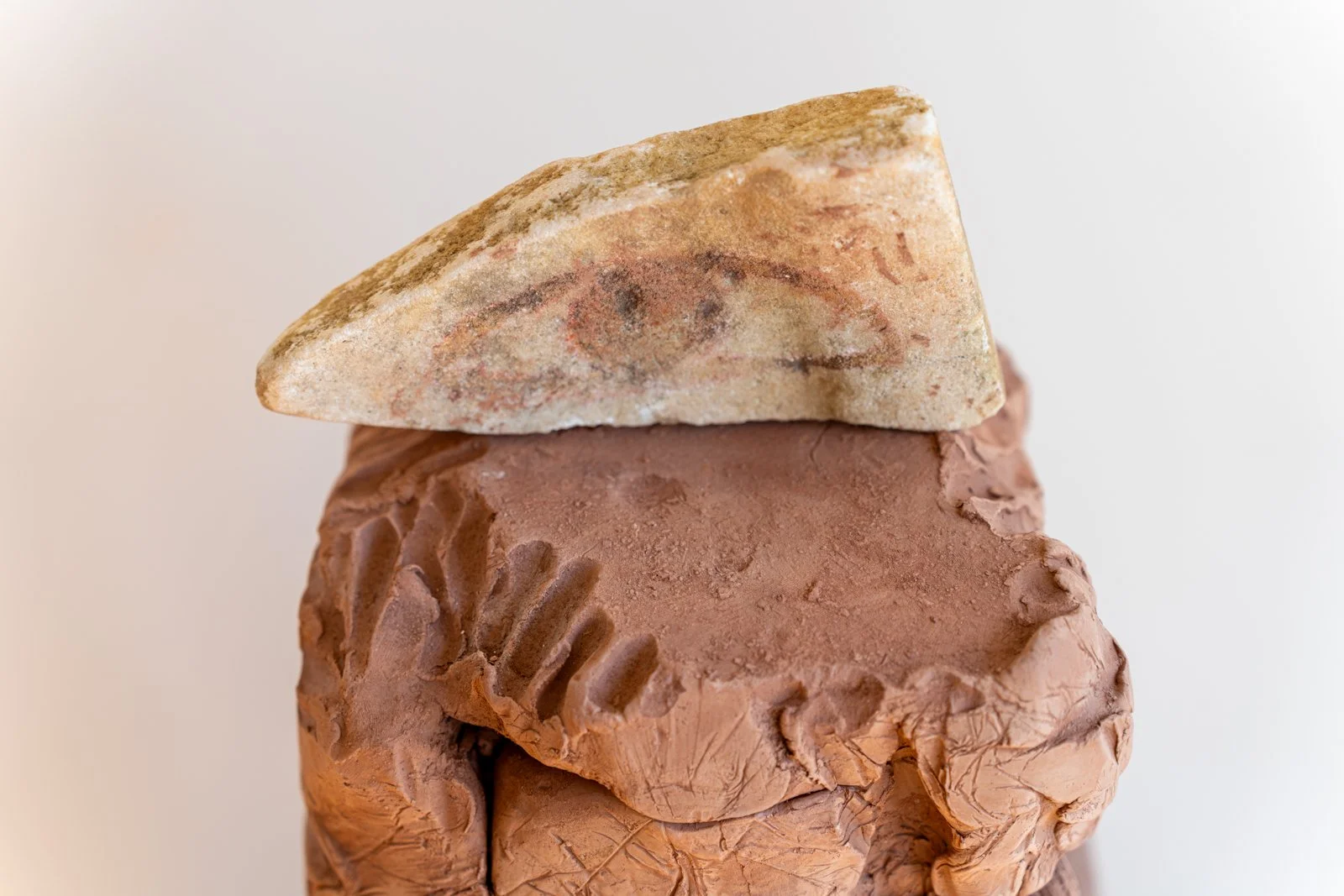 The Mountain, A Kind of Owl Beside The Earth, Eye, The Water Moves, And The Lover’s, Too, Open And Here, Says: “A Change In The Surface So That I Can Understand” (Eye, Triangle), 2024, Marble, brick, unfired clay, shell, beach stone, sea glass,40” X 