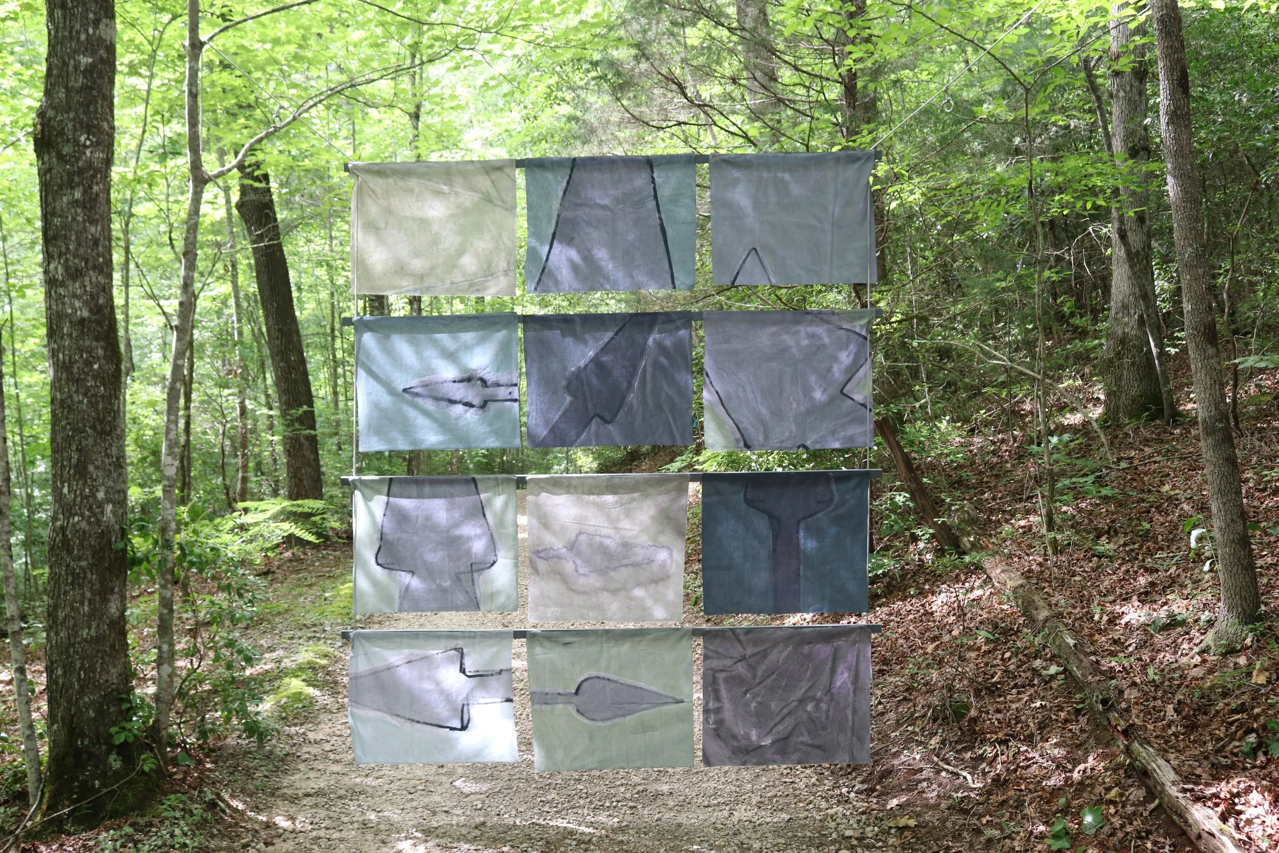 Song of Amergin (Floating, outdoors), Am bri i fodb fras feochtu/I am the head of the spear in battle, Acrylic, dye, muslin, rope, 120” X 96," Installation at the Hambidge Center for the Arts, Rabun Gap, GA, 2019, installation view ii